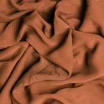 why do natural fiber clothes shrink even when washed correctly